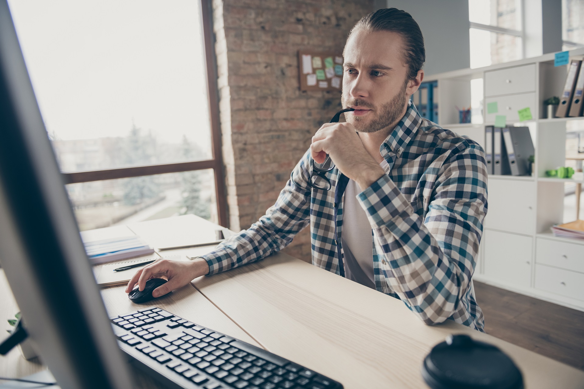 Guy looking Computer.